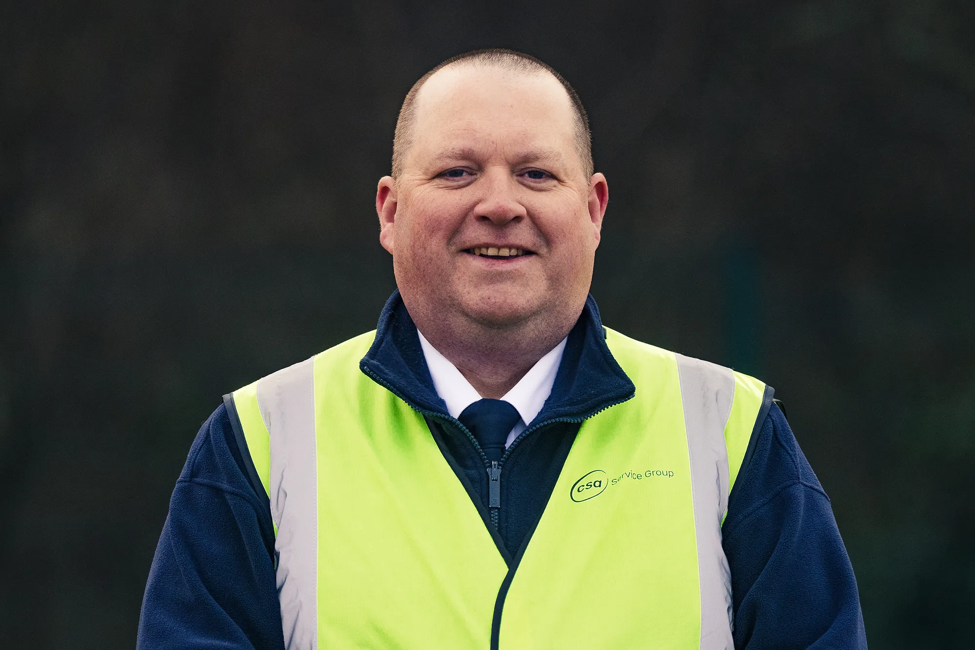 A smiling CSA security officer