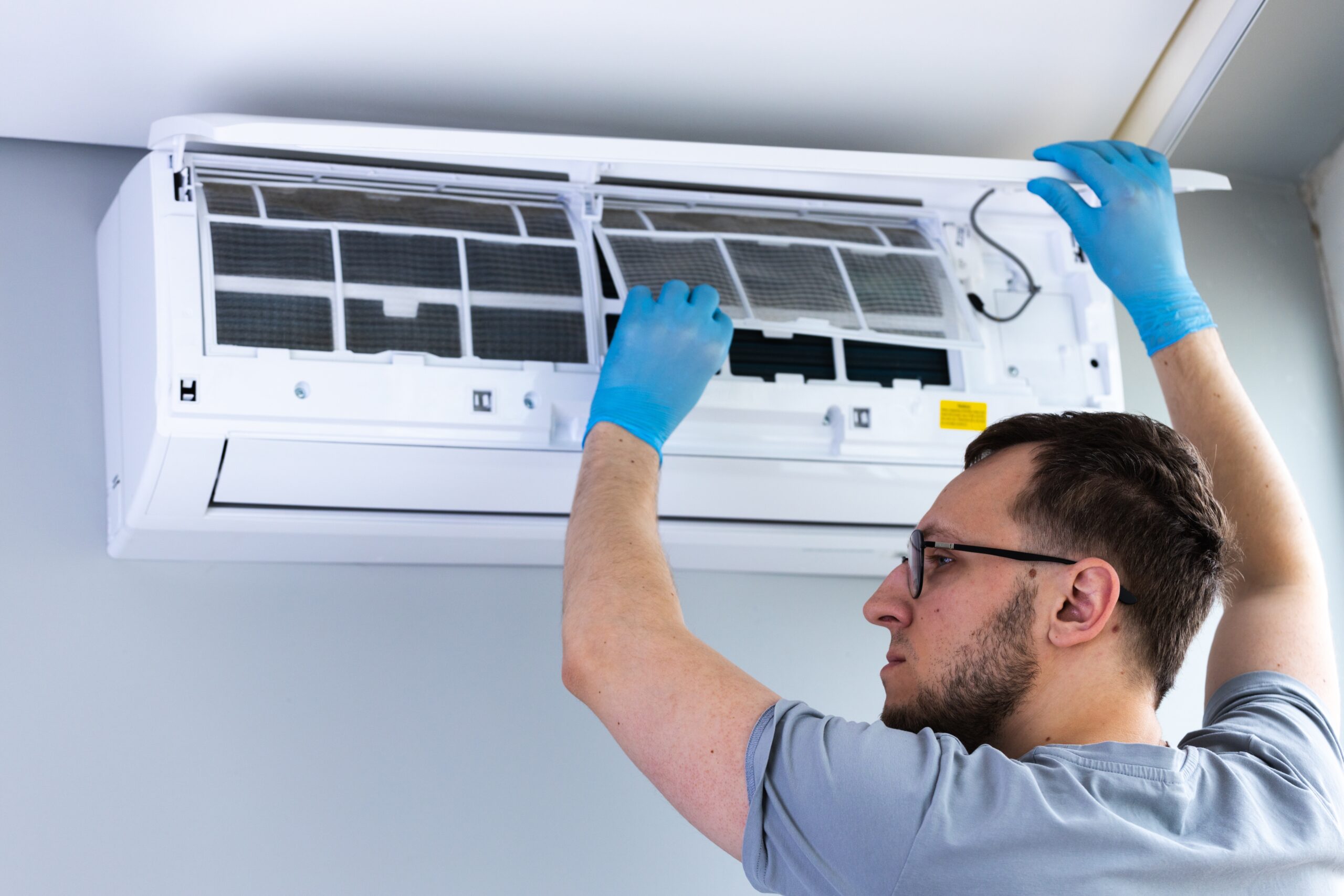 Air conditioning unit being cleaned